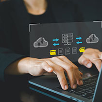 Student comparing local and cloud storage options on a laptop, reviewing data security and backup strategies.