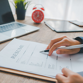 Recent college graduate writing resume, preparing references and job search documentation.