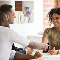 Candidate shaking hand of recruiting manager congratulating hired applicant with handshake, successful interview