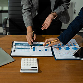 Business consultants discuss strategy in modern office.