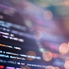 Close-up of a computer screen displaying source code symbolizing IT development and professional coding