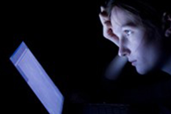 Online student studying late night