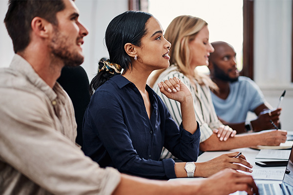 Office, attention and business people at seminar for meeting, project development or audience in corporate training. Objectives, values and team in conference room with ideas, workshop for internship